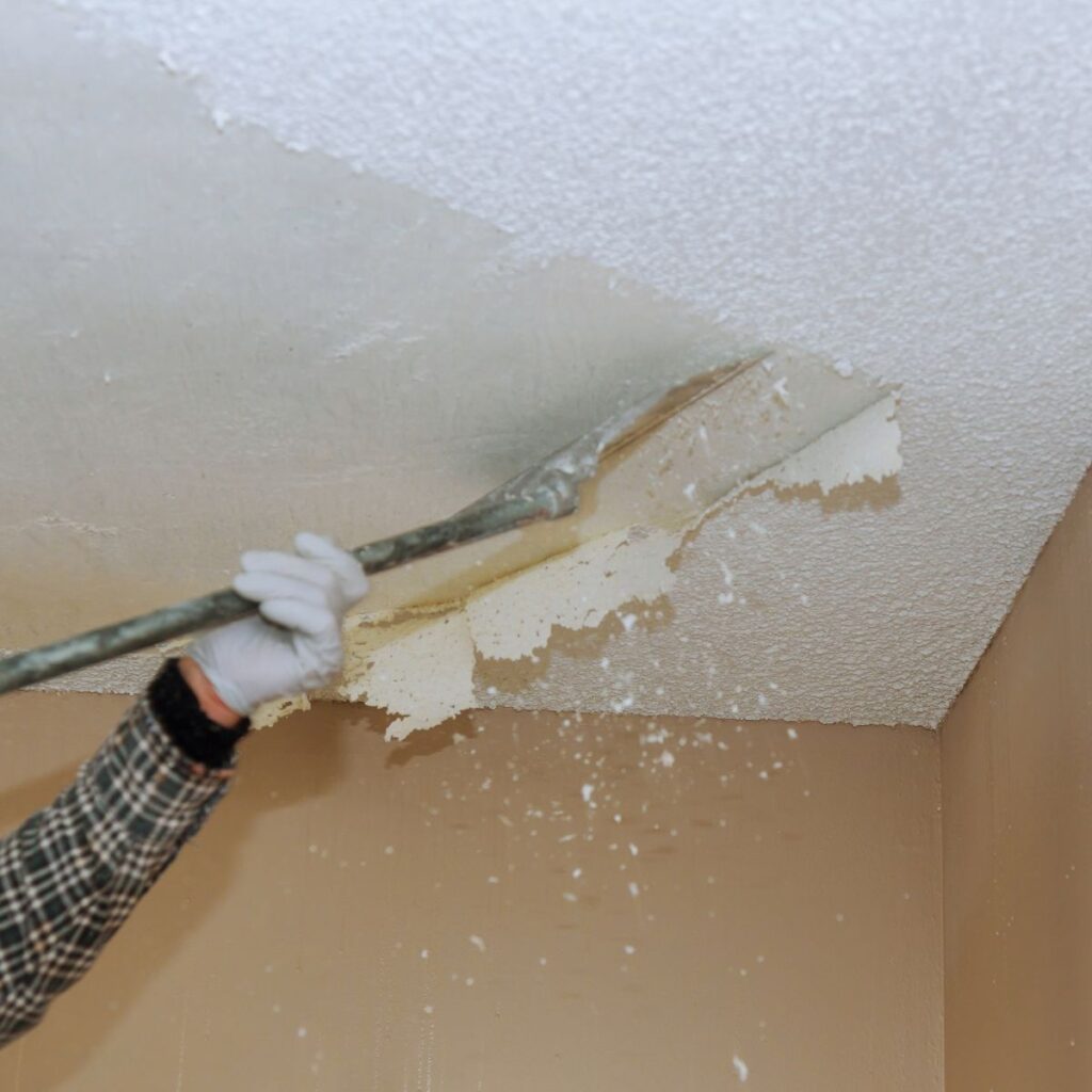 handyman removing popcorn ceilings
