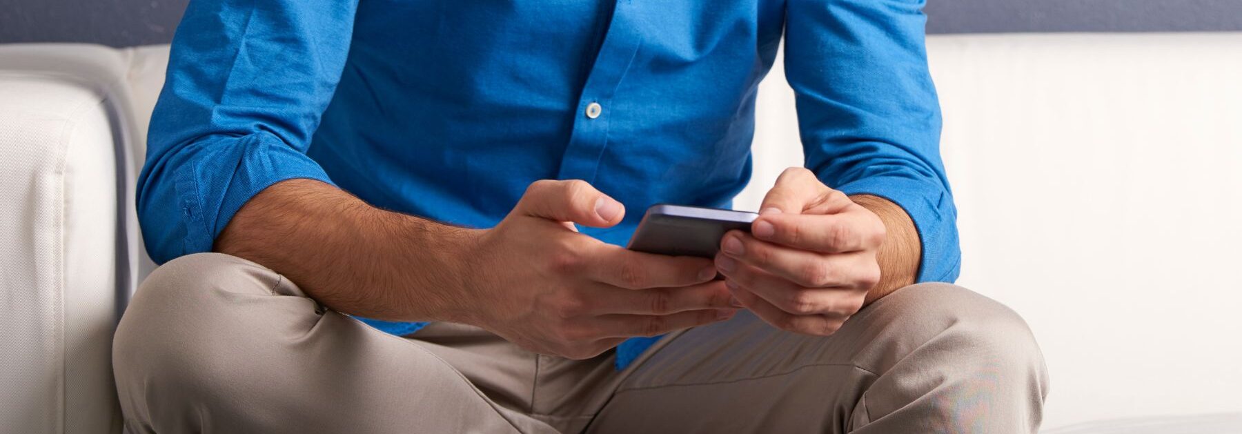 man reviewing texfix on his iphone