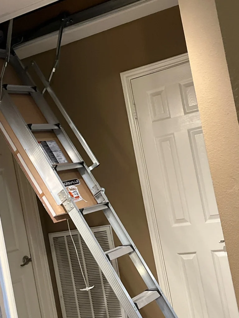 San Antonio foldable aluminum attic ladder extended in an indoor space